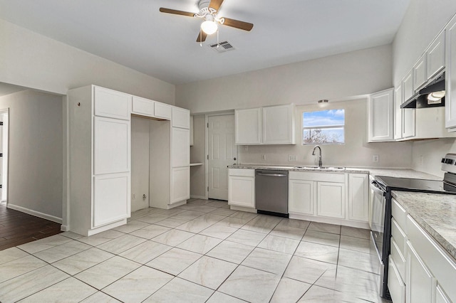 kitchen featuring sink, light tile patterned floors, appliances with stainless steel finishes, ceiling fan, and white cabinets