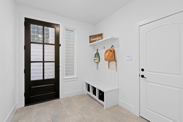 mudroom with light tile patterned floors