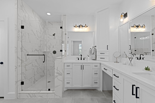 bathroom featuring vanity and a shower with shower door