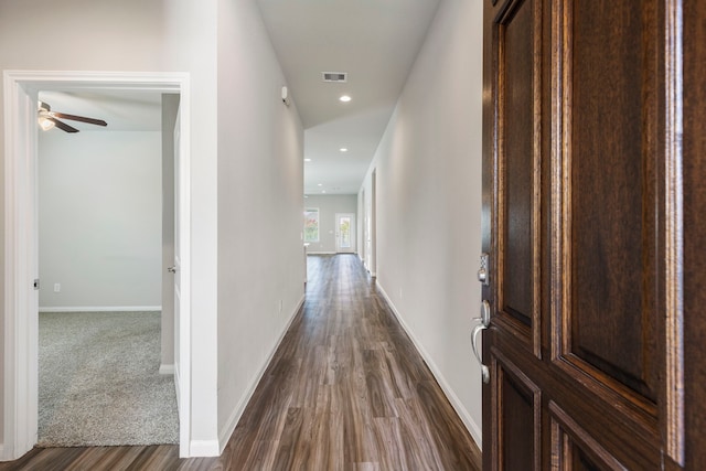 hall with dark hardwood / wood-style floors