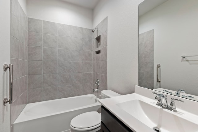 full bathroom featuring vanity, toilet, and tiled shower / bath