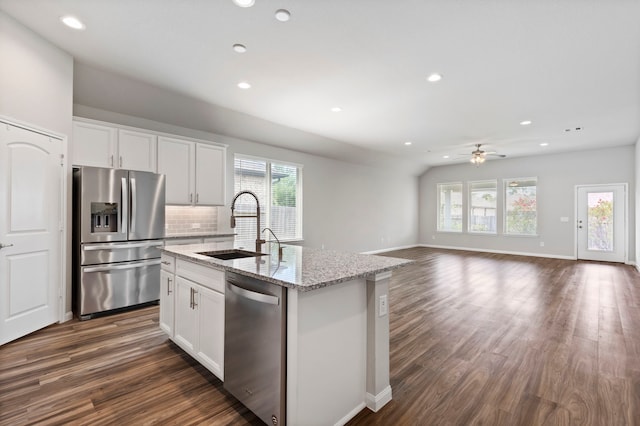 kitchen featuring sink, ceiling fan, stainless steel appliances, a kitchen island with sink, and white cabinets