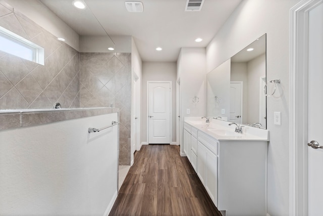 bathroom with hardwood / wood-style flooring and vanity