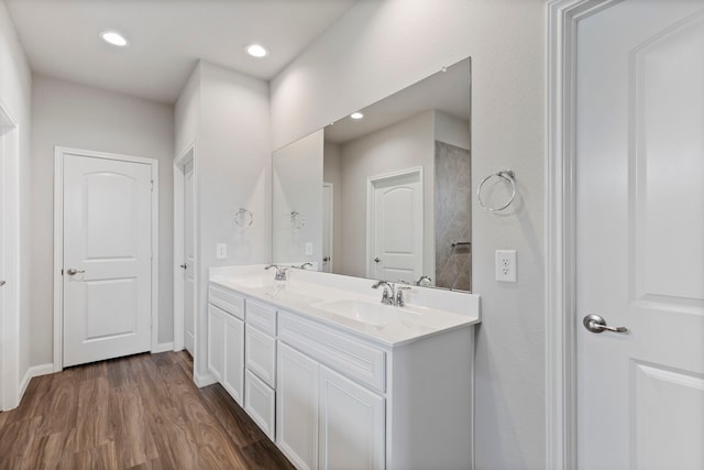 bathroom with hardwood / wood-style flooring and vanity