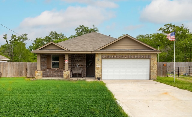 view of front of property with a garage and a front lawn