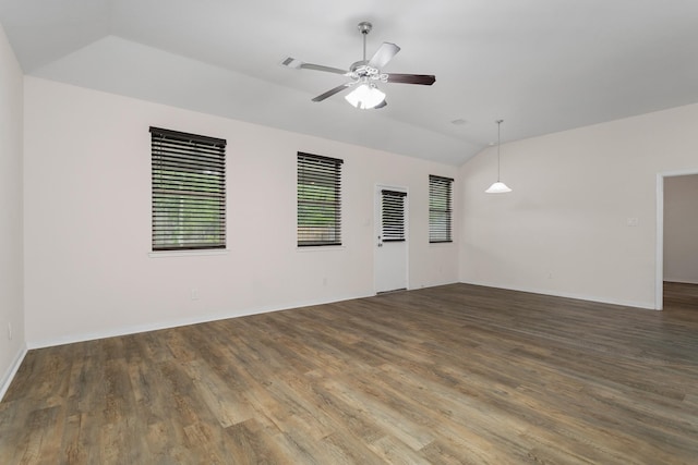 unfurnished room with vaulted ceiling, dark wood-type flooring, and ceiling fan