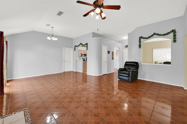 unfurnished living room with lofted ceiling, ceiling fan with notable chandelier, and tile patterned floors