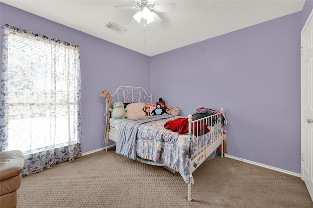 bedroom featuring ceiling fan and carpet flooring