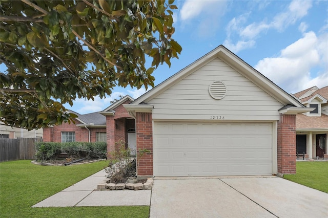 view of front of house featuring a garage and a front yard