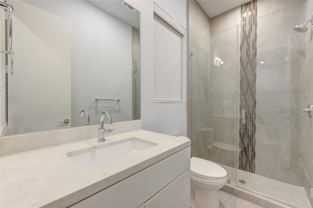 bathroom featuring walk in shower, vanity, and toilet