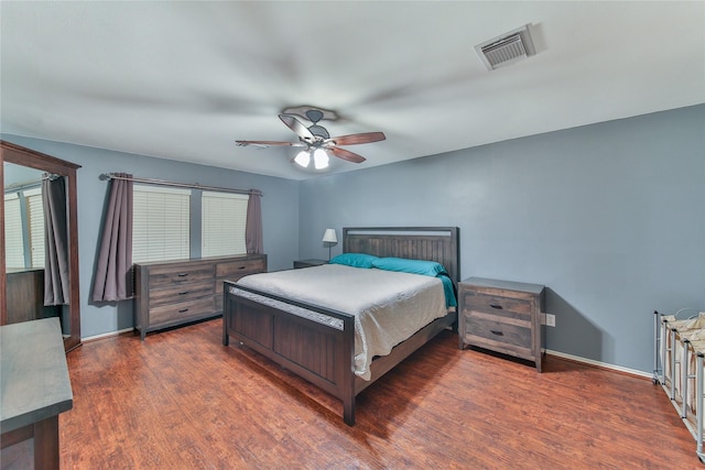 bedroom featuring dark hardwood / wood-style floors and ceiling fan