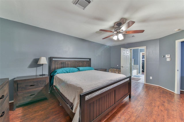 bedroom featuring ensuite bathroom, dark hardwood / wood-style floors, and ceiling fan