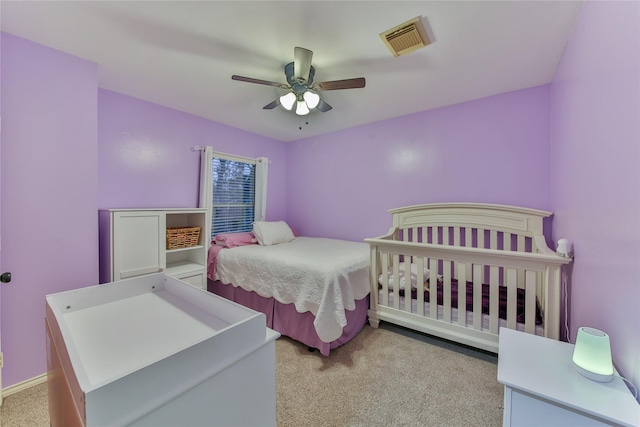 carpeted bedroom with ceiling fan