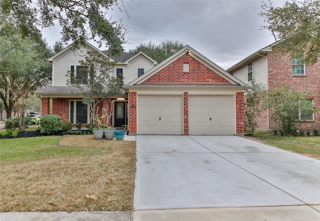 view of front property featuring a garage and a front yard