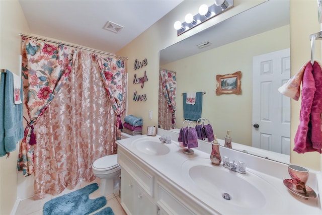 bathroom with vanity, a shower with curtain, tile patterned floors, and toilet