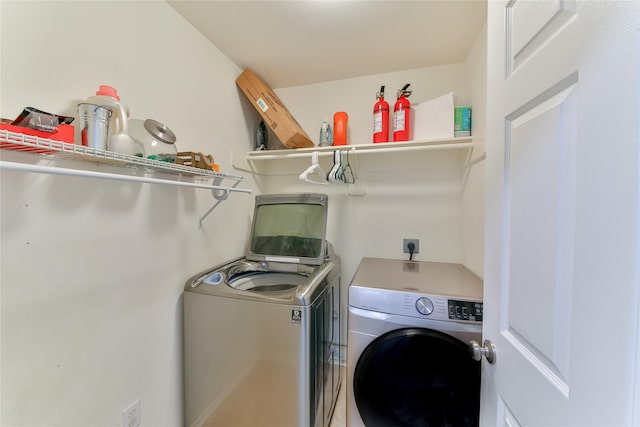 laundry room featuring washing machine and dryer