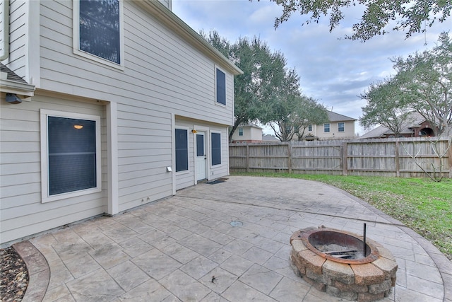 view of patio / terrace featuring an outdoor fire pit