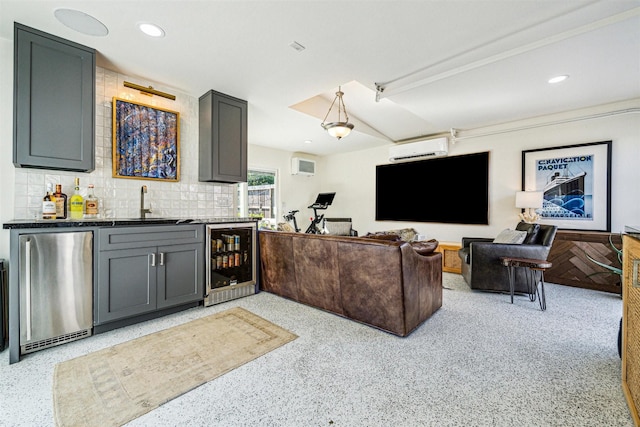 living room featuring wet bar, beverage cooler, and a wall mounted AC