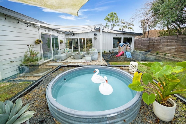 view of pool featuring an outbuilding