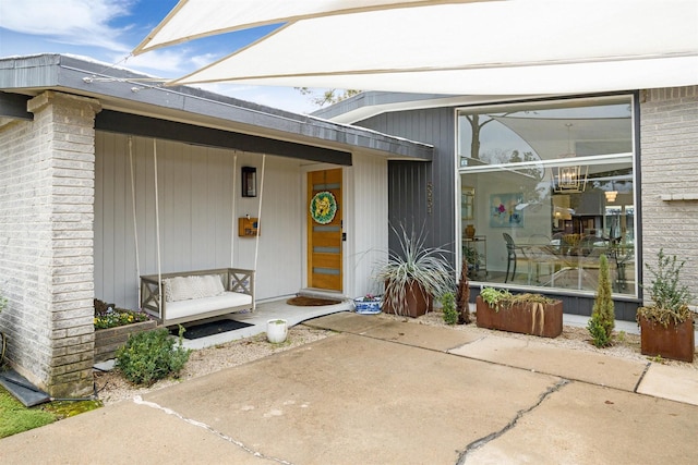 doorway to property featuring a patio area