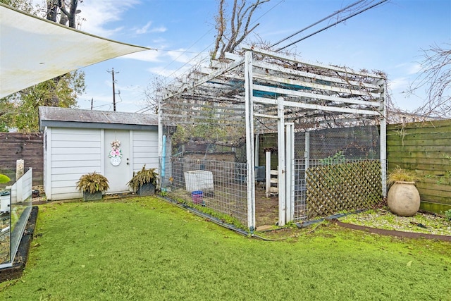 view of outbuilding featuring a lawn