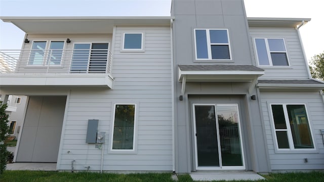 rear view of house featuring a balcony