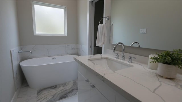 bathroom with vanity and a bathing tub