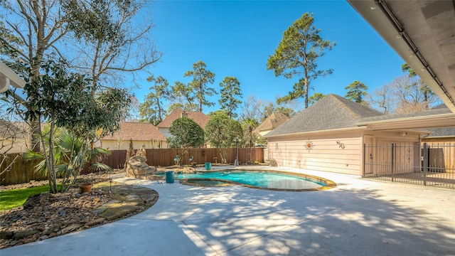 view of swimming pool with a patio area, a fenced backyard, and a fenced in pool