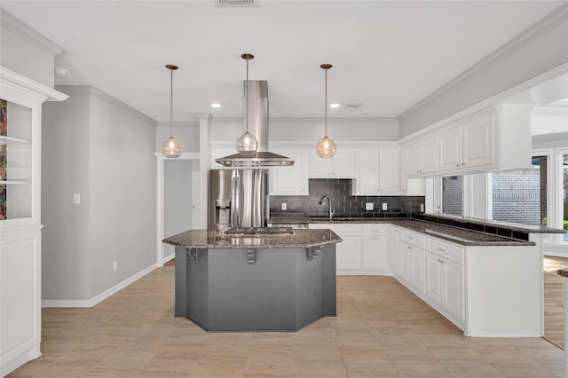 kitchen featuring a breakfast bar area, white cabinetry, appliances with stainless steel finishes, backsplash, and island exhaust hood