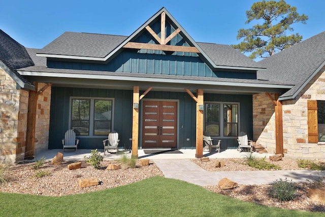 view of front of property featuring covered porch and french doors