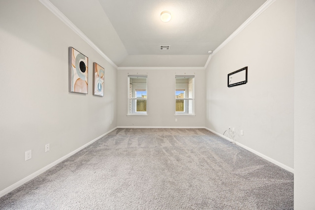 carpeted spare room featuring ornamental molding