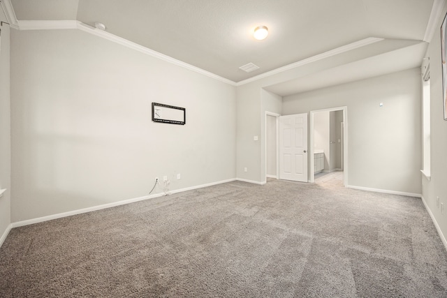 unfurnished bedroom featuring crown molding, carpet floors, and ensuite bathroom