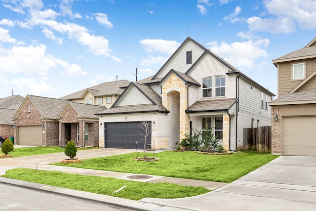 view of front of home featuring a garage and a front lawn