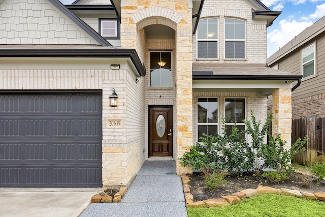 entrance to property featuring a garage