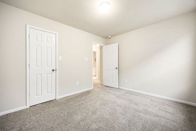 empty room featuring carpet flooring