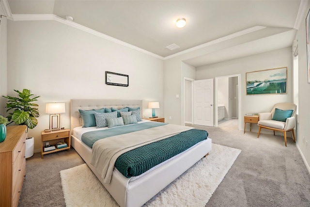 bedroom featuring crown molding, carpet floors, and connected bathroom