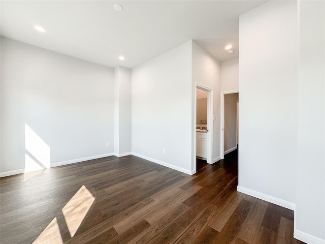 spare room featuring dark hardwood / wood-style floors