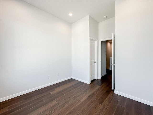 spare room featuring dark hardwood / wood-style flooring