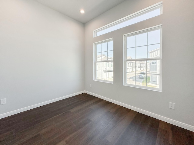 empty room featuring dark wood-type flooring