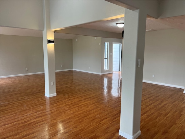 interior space featuring dark hardwood / wood-style floors and a textured ceiling