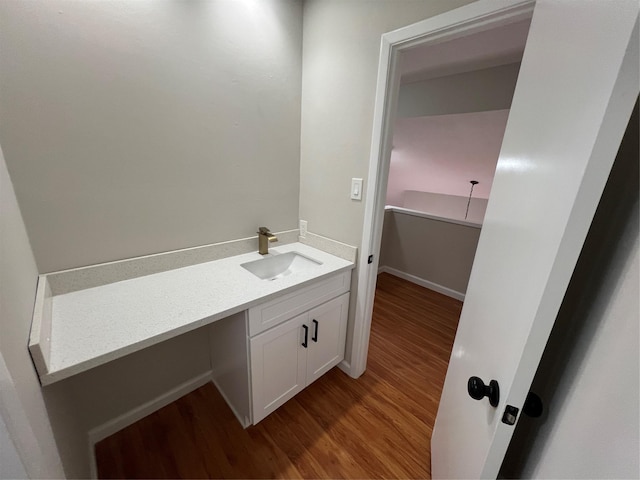 bathroom with vanity and hardwood / wood-style floors