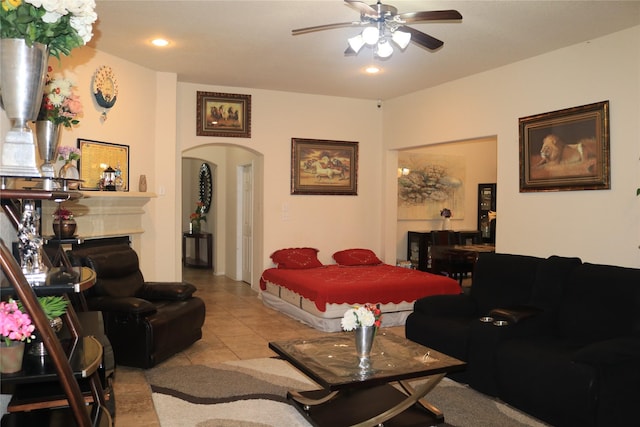 living room with light tile patterned floors and ceiling fan