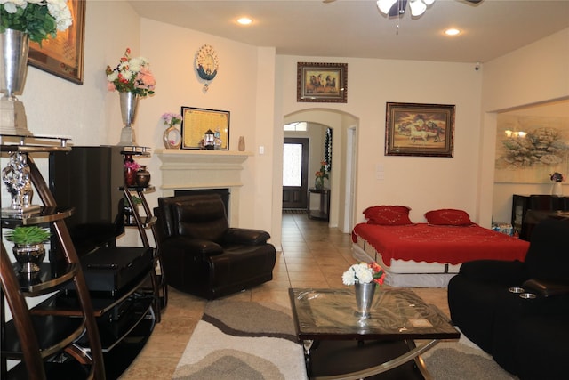 tiled living room featuring ceiling fan