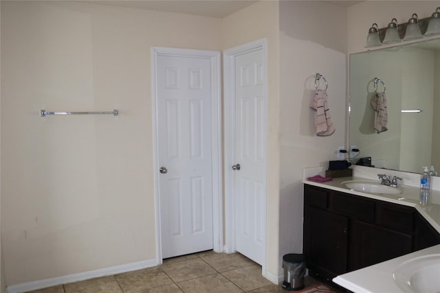 bathroom with tile patterned flooring and vanity