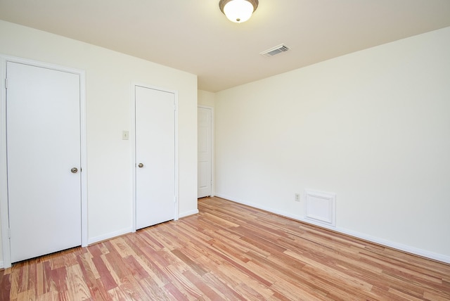 unfurnished bedroom featuring light hardwood / wood-style flooring