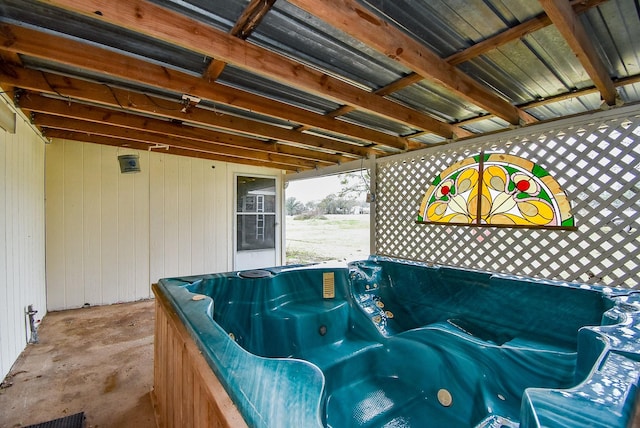 view of patio / terrace with a hot tub