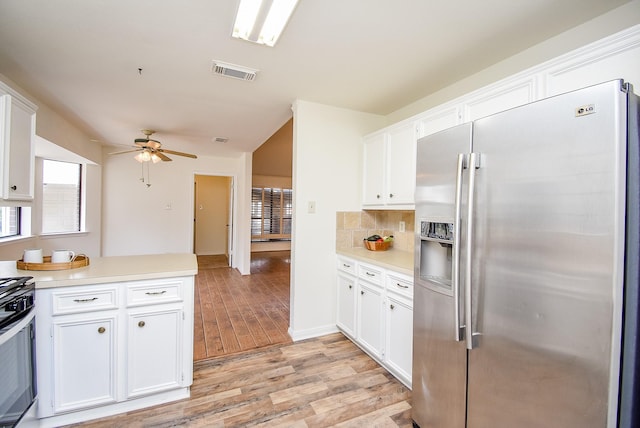 kitchen featuring white cabinetry, visible vents, appliances with stainless steel finishes, and light countertops