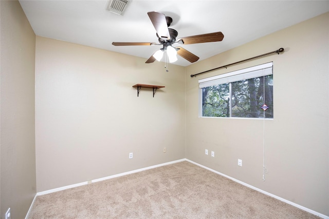 empty room with ceiling fan and light colored carpet