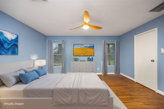 bedroom featuring wood-type flooring and ceiling fan