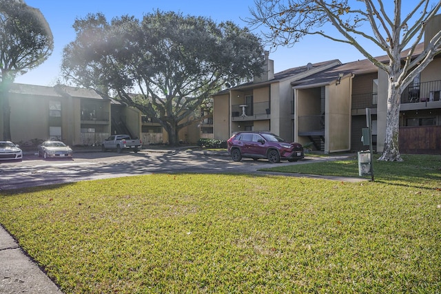 view of community featuring a yard